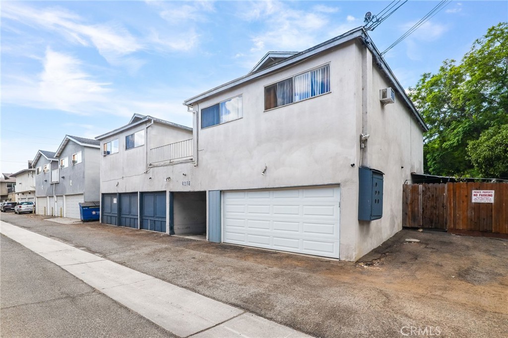 2601 Andover Avenue Fullerton, CA 92831 - Photo 9 of 14 a view of a white house with a large space and a garage