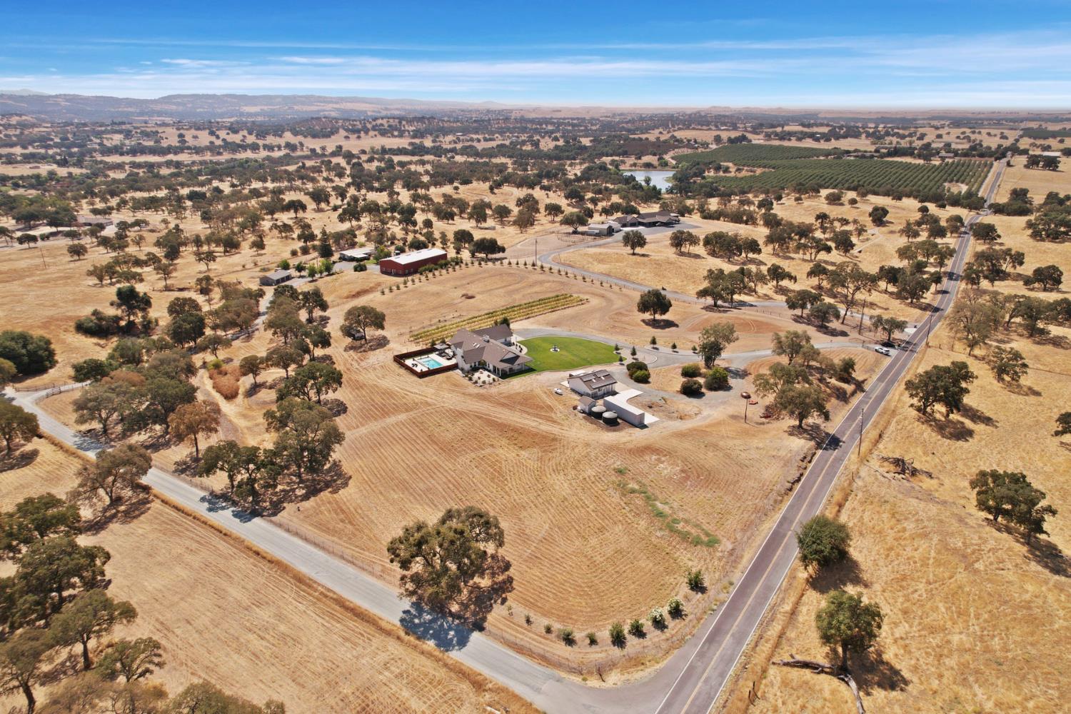 8779 Ospital Road Valley Springs, CA 95252 - Photo 11 of 80 an aerial view of residential houses with outdoor space