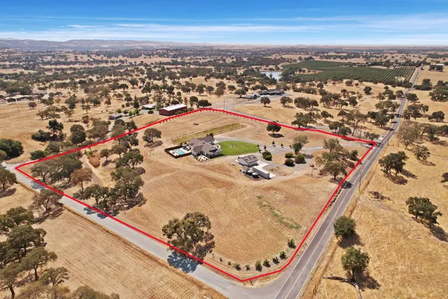 a kitchen with stainless steel appliances a sink stove and cabinets