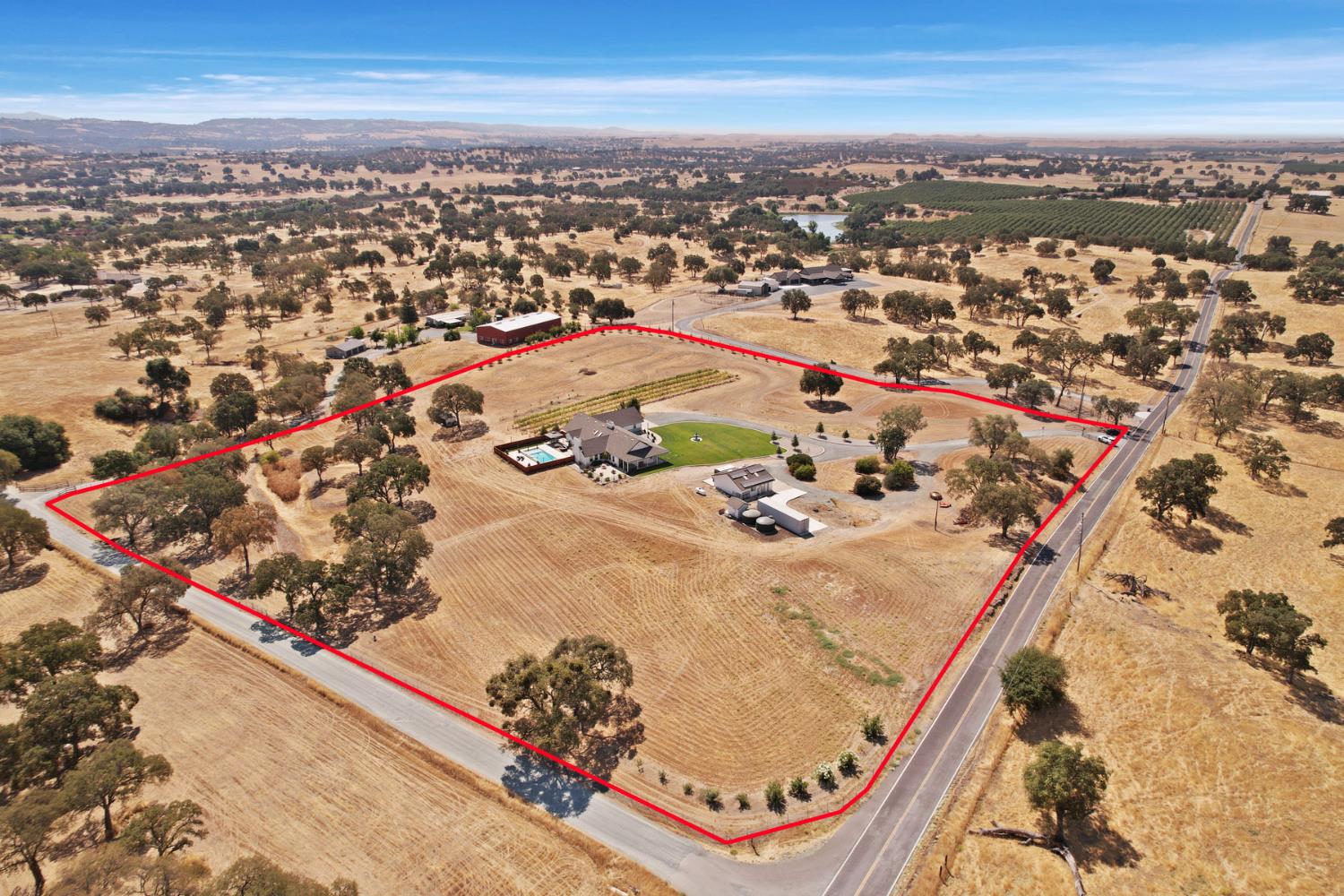 8779 Ospital Road Valley Springs, CA 95252 - Photo 12 of 80 an aerial view of residential houses with outdoor space