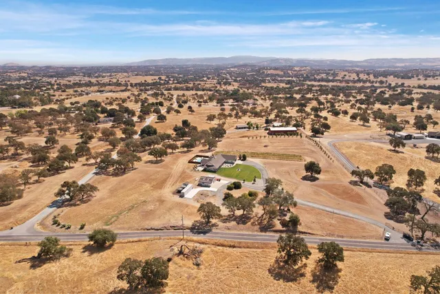 a kitchen that has a sink a stove and window