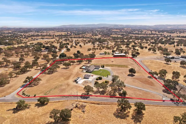 a kitchen with stainless steel appliances a stove a sink and a refrigerator