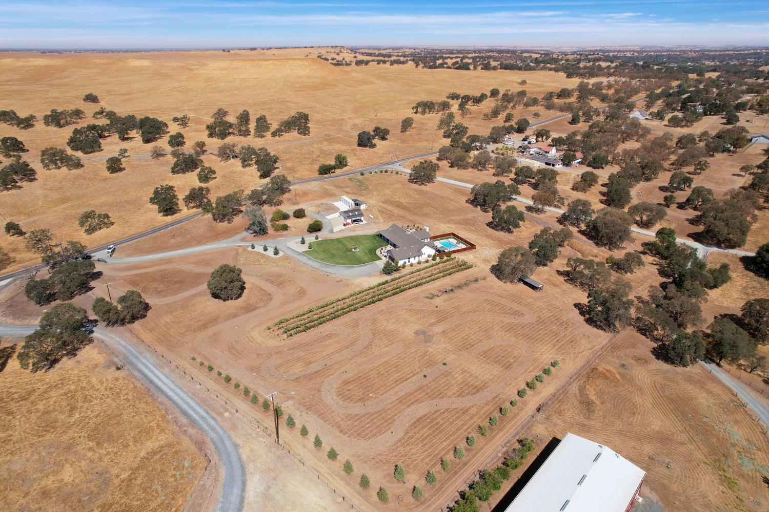 8779 Ospital Road Valley Springs, CA 95252 - Photo 17 of 80 an aerial view of residential houses with outdoor space