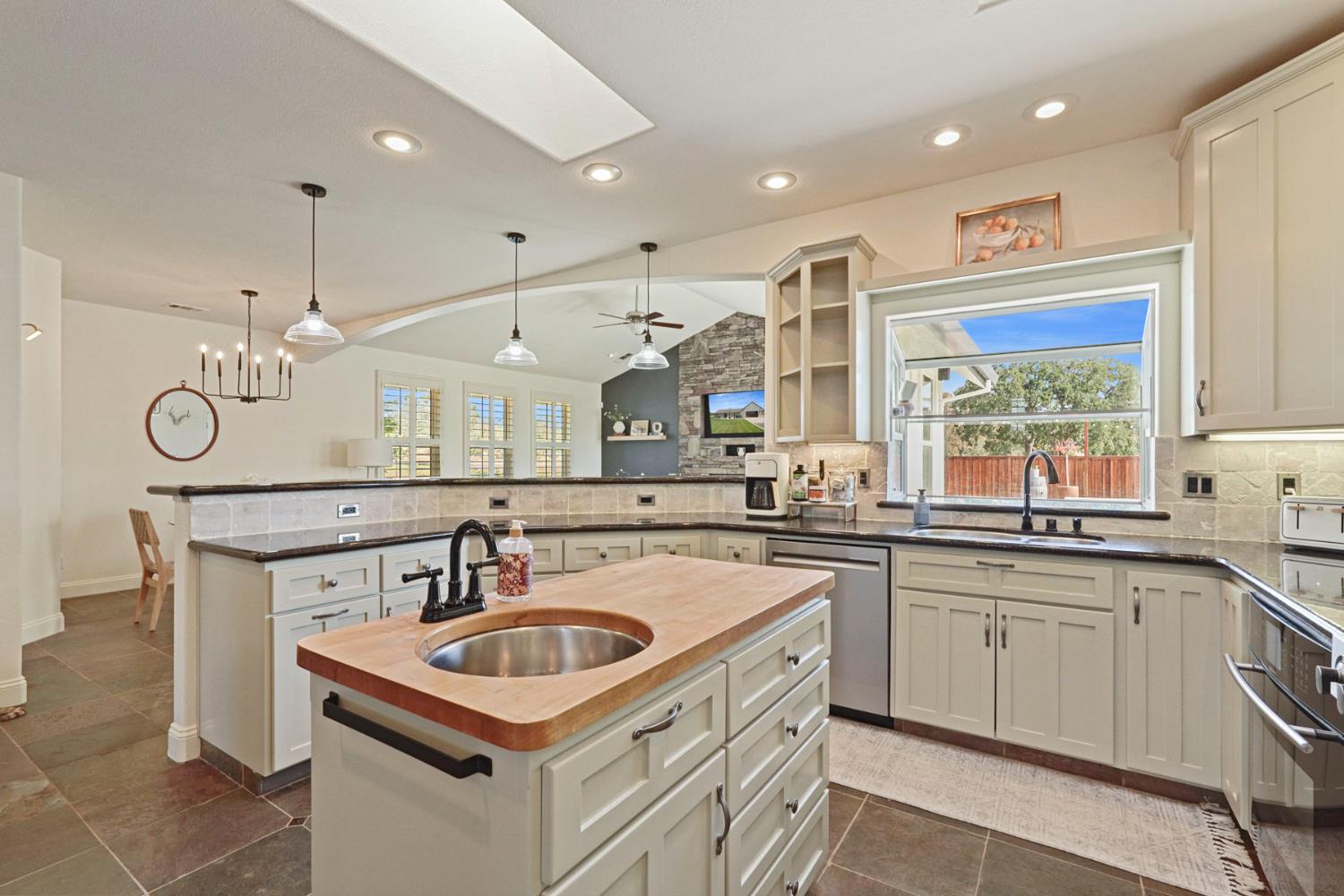 8779 Ospital Road Valley Springs, CA 95252 - Photo 24 of 80 a kitchen that has a sink a stove and window