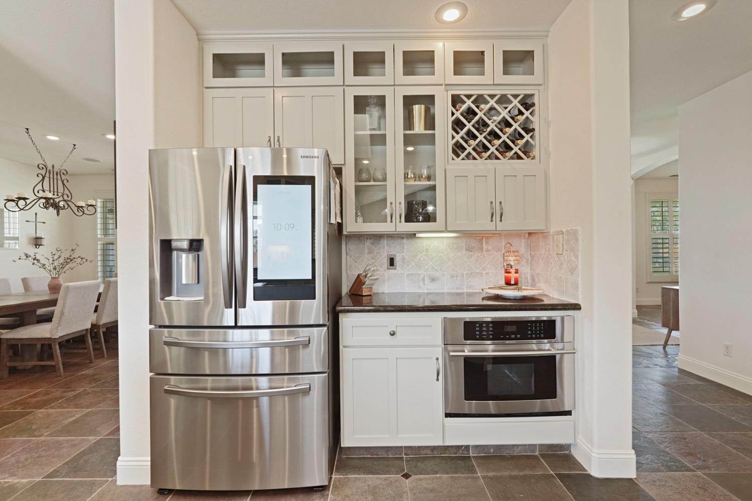 8779 Ospital Road Valley Springs, CA 95252 - Photo 26 of 80 a kitchen with stainless steel appliances granite countertop a refrigerator and a stove top oven
