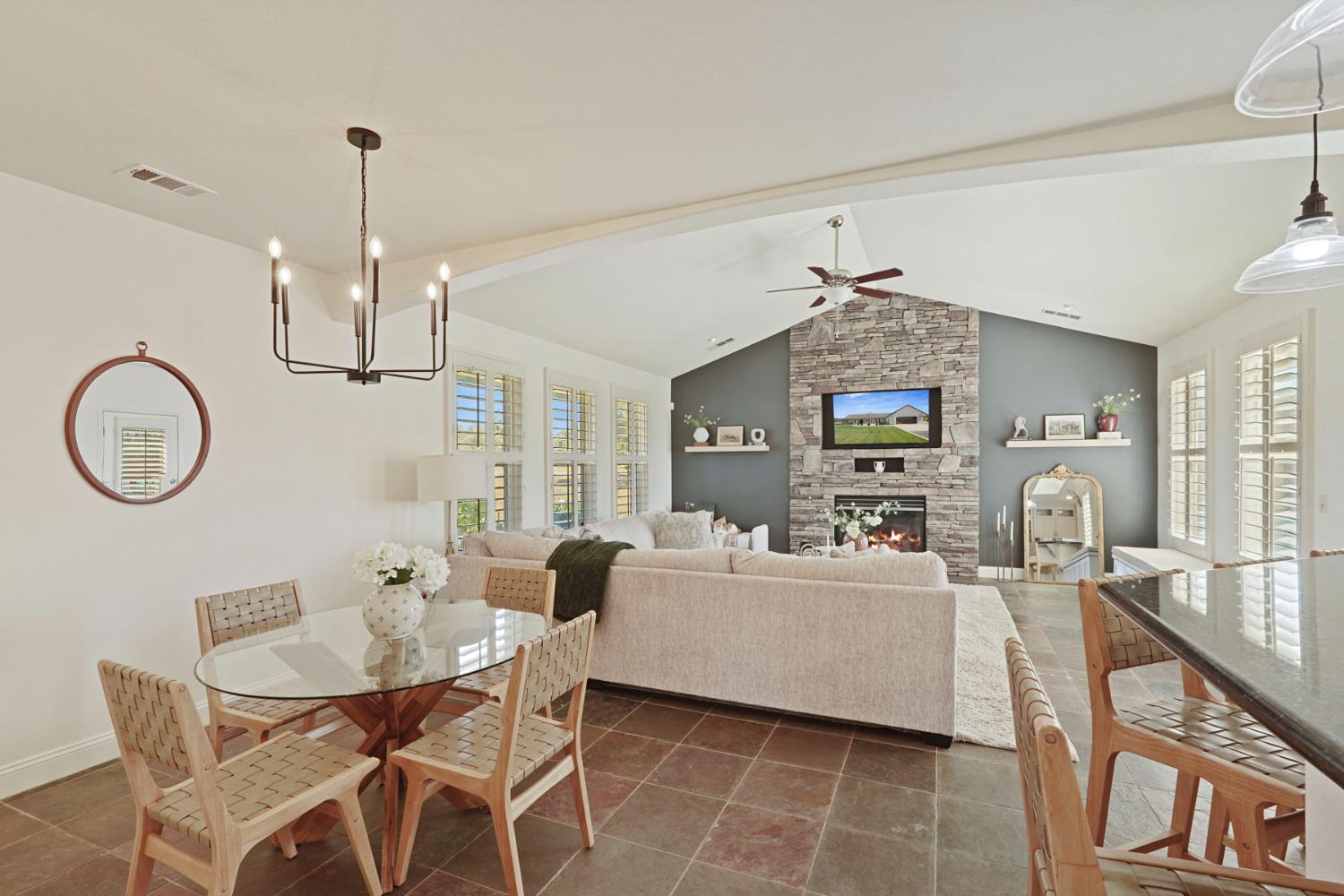 8779 Ospital Road Valley Springs, CA 95252 - Photo 33 of 80 a living room with furniture a dining table and chairs