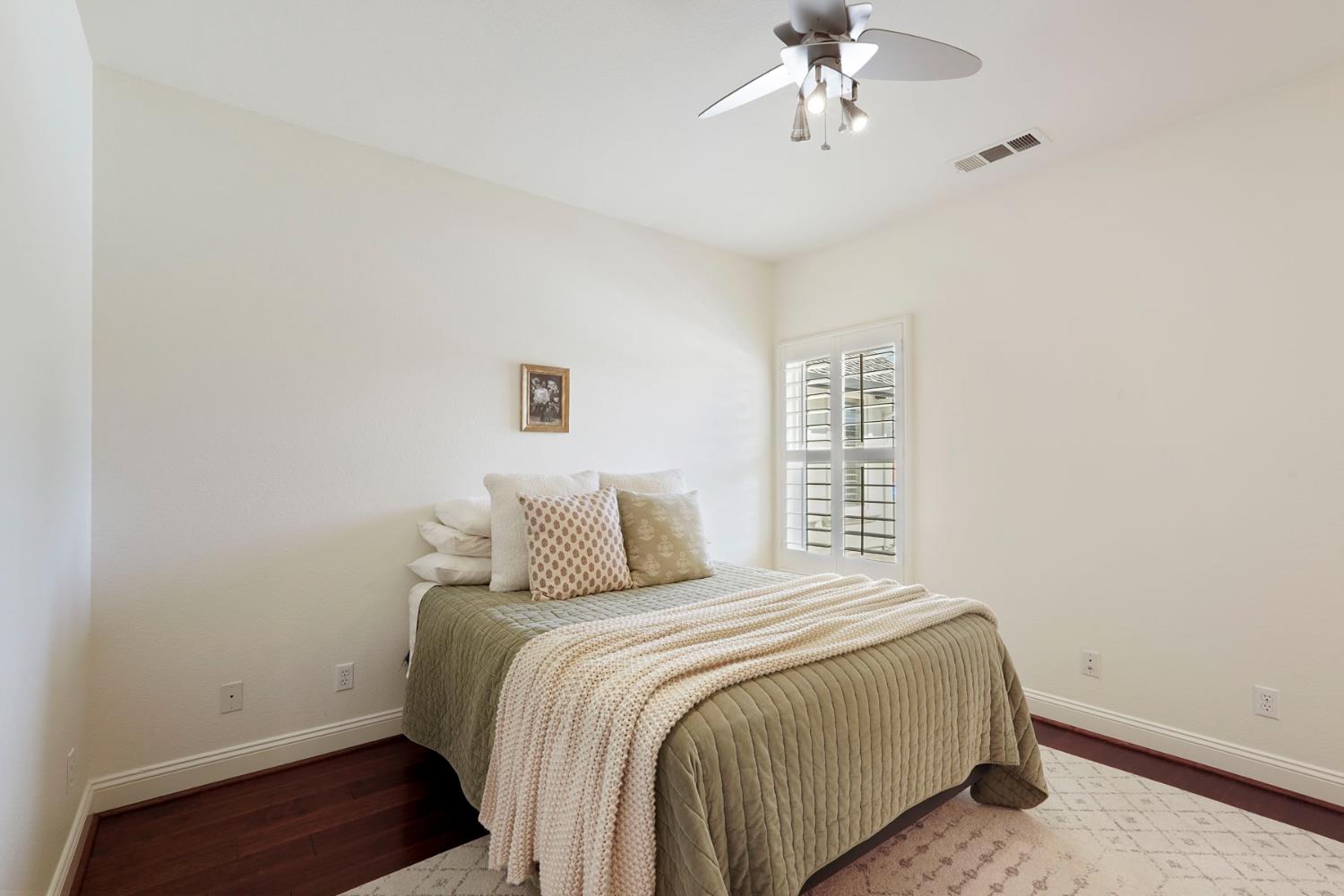 8779 Ospital Road Valley Springs, CA 95252 - Photo 40 of 80 a bedroom with a bed and a chandelier