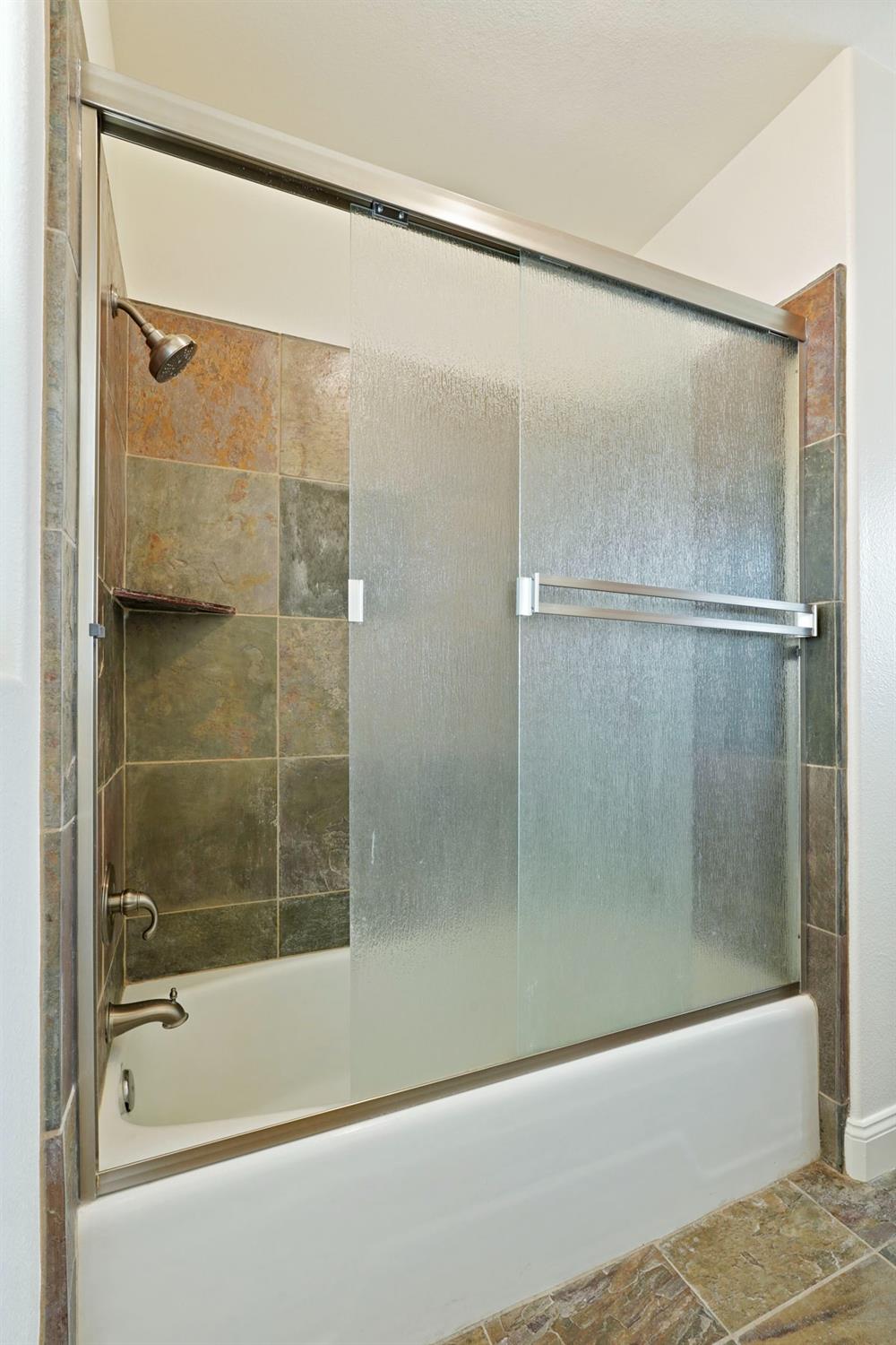 8779 Ospital Road Valley Springs, CA 95252 - Photo 43 of 80 a bathroom with a shower and a bath tub