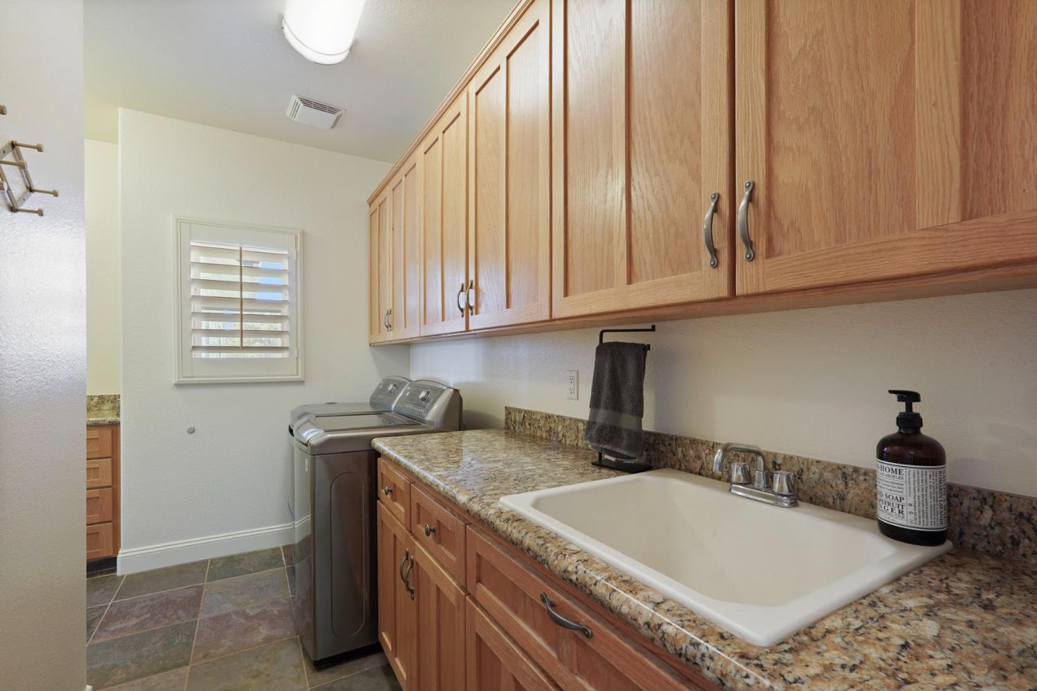 8779 Ospital Road Valley Springs, CA 95252 - Photo 44 of 80 a kitchen with a sink and cabinets