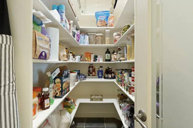 a front view of a house with garden and porch