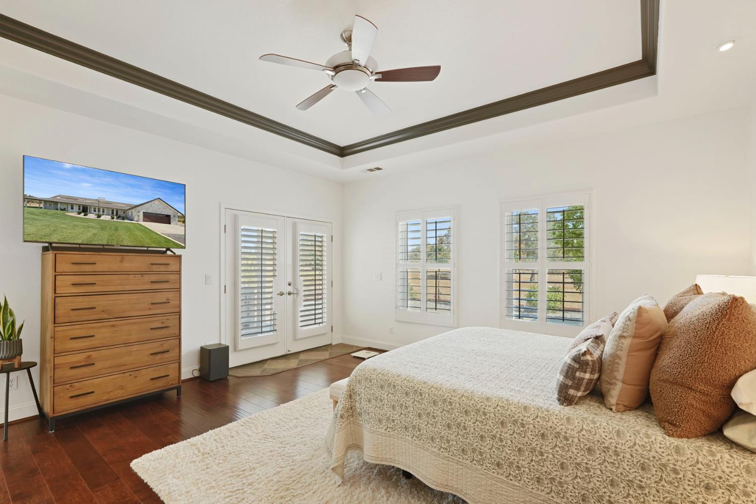 8779 Ospital Road Valley Springs, CA 95252 - Photo 55 of 80 a bedroom with a large bed and wooden floor