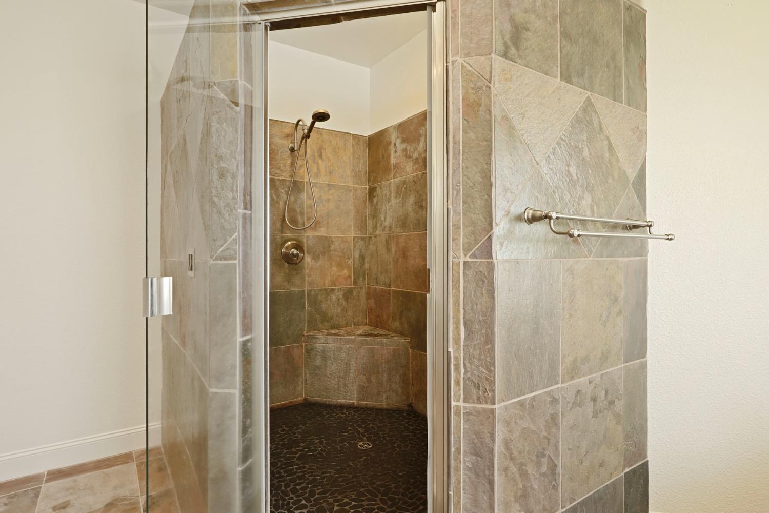 8779 Ospital Road Valley Springs, CA 95252 - Photo 58 of 80 a bathroom with a glass shower door