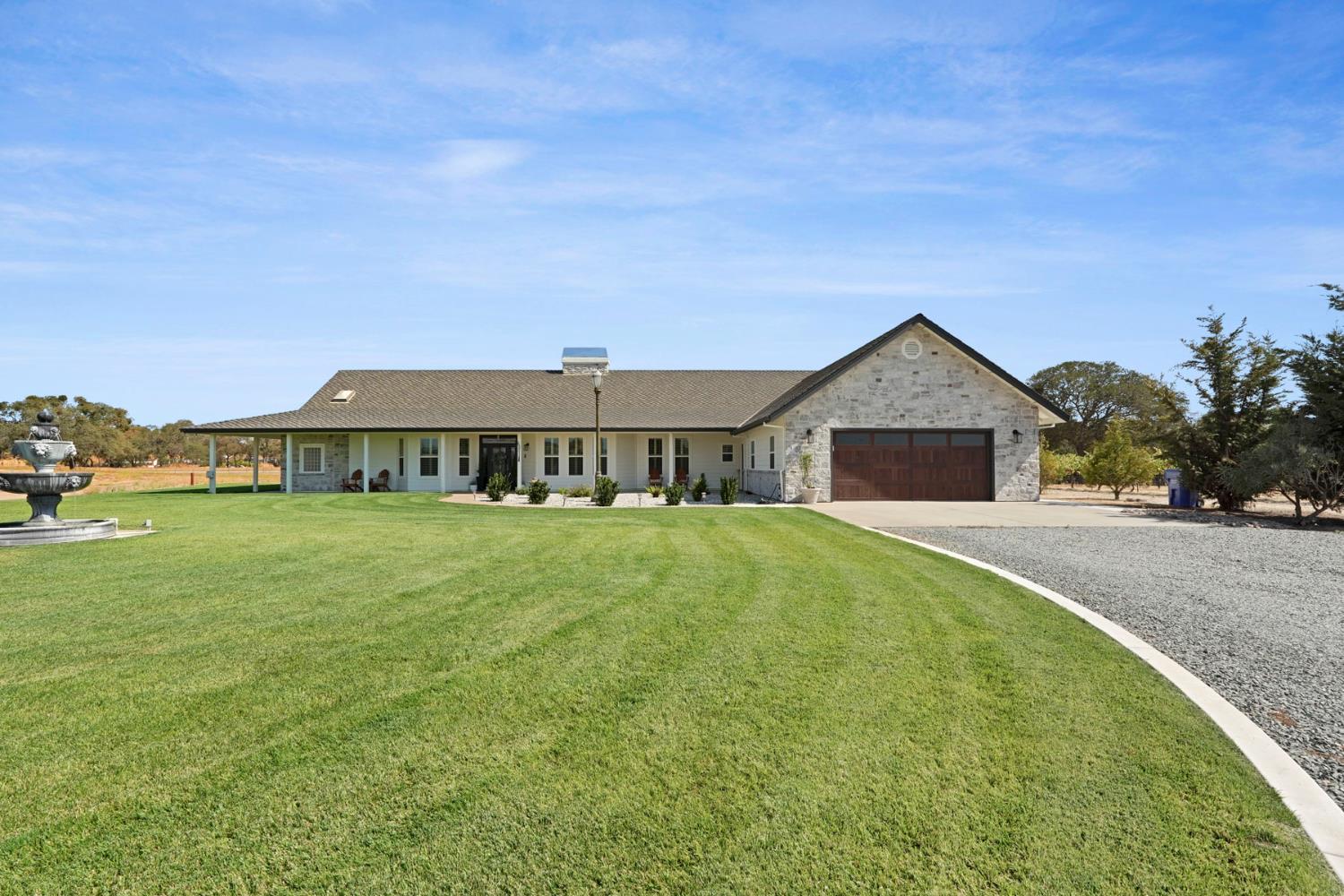 8779 Ospital Road Valley Springs, CA 95252 - Photo 75 of 80 a front view of a house with garden