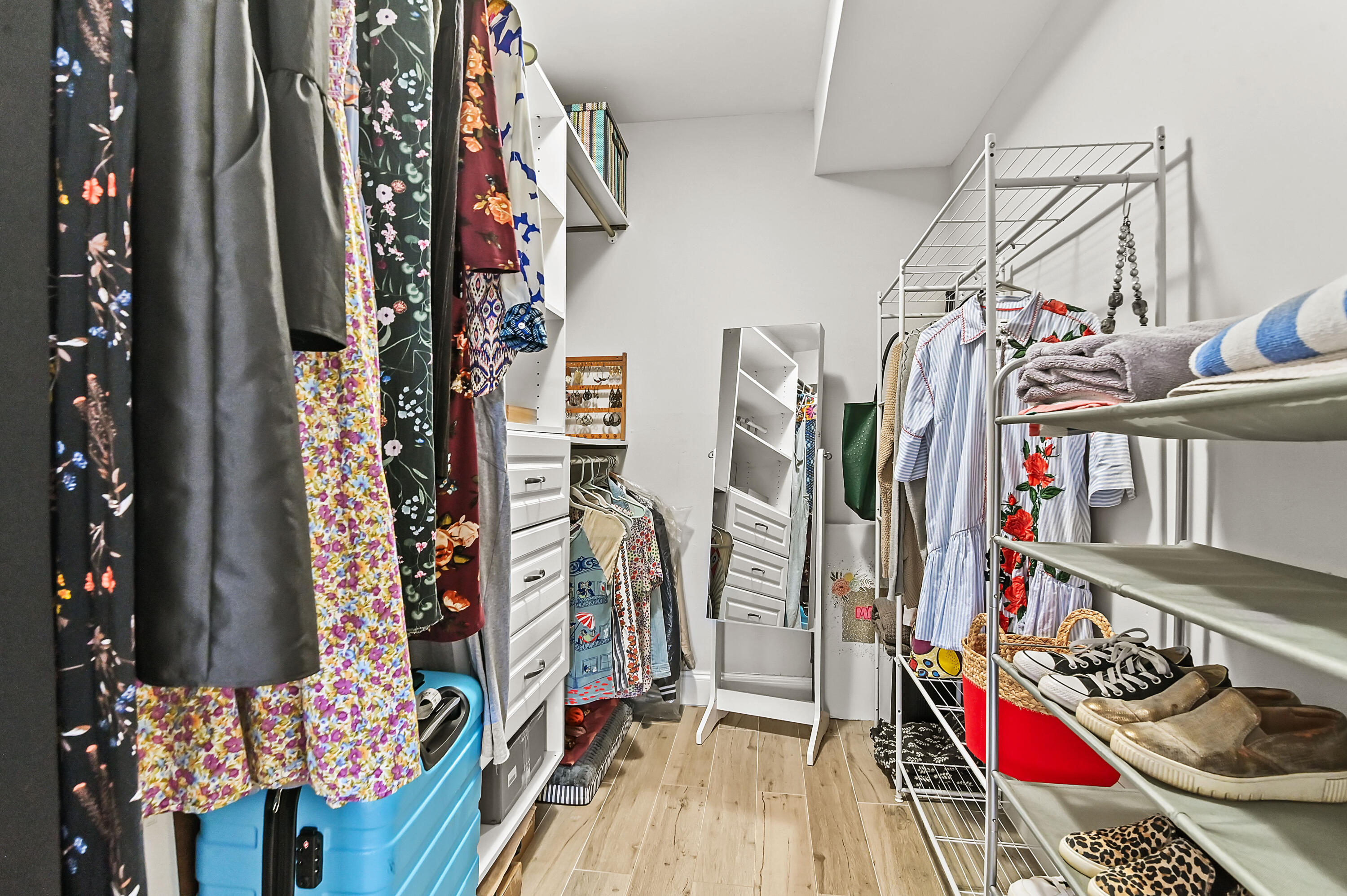6400 Northwest 2nd Avenue, Unit 124 Boca Raton, FL 33487 - Photo 22 of 33 a view of walk in closet with clothes