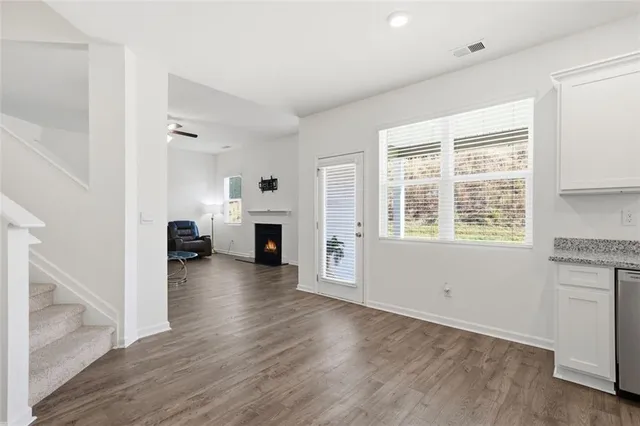a view of living room with furniture and fireplace