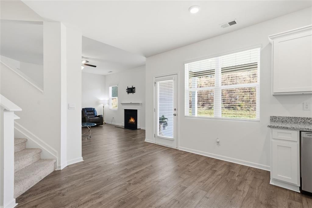 469 Ralph Still Road Dacula, GA 30019 - Photo 14 of 42 a view of living room with furniture and fireplace