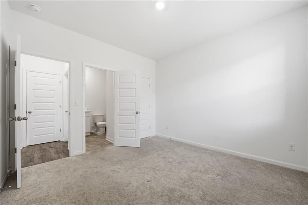 469 Ralph Still Road Dacula, GA 30019 - Photo 18 of 42 an empty room with a bench