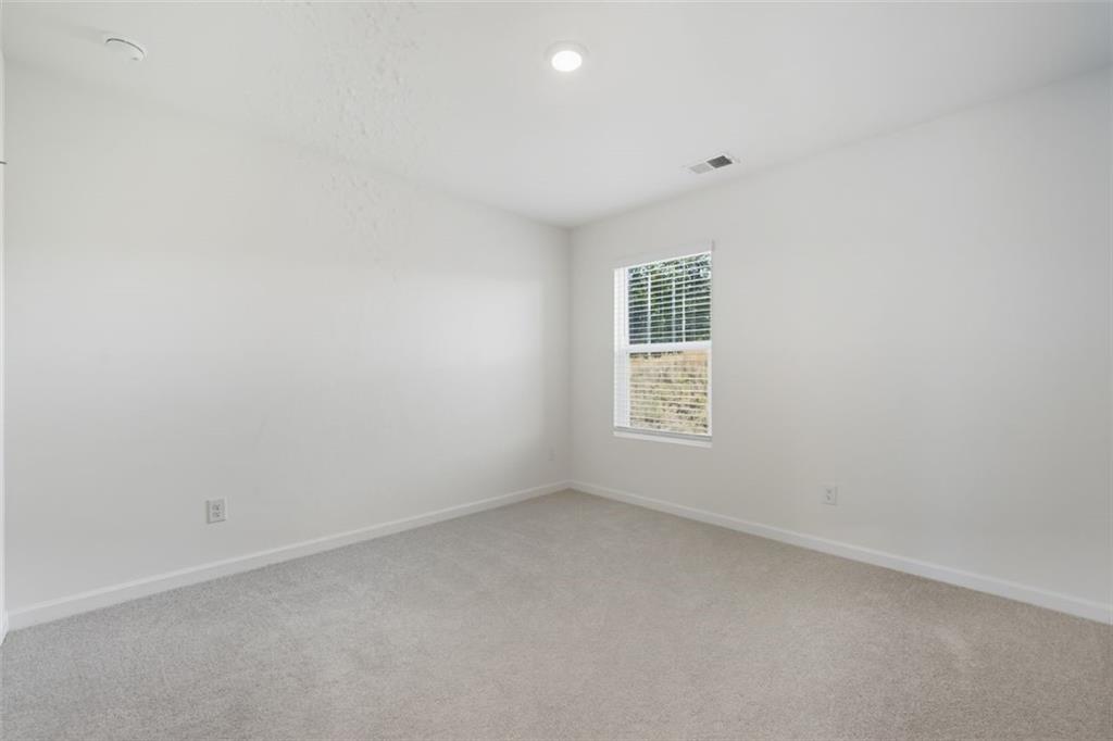 469 Ralph Still Road Dacula, GA 30019 - Photo 20 of 42 an empty room with a window