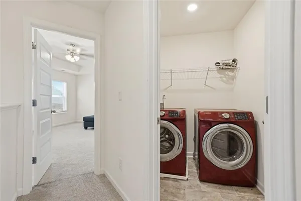 a view of a hallway with washer and dryer
