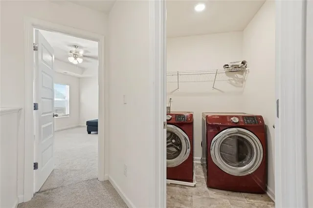 a view of a hallway with washer and dryer