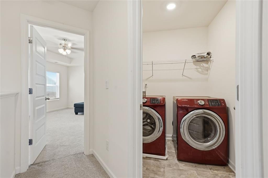 469 Ralph Still Road Dacula, GA 30019 - Photo 29 of 42 a view of a hallway with washer and dryer