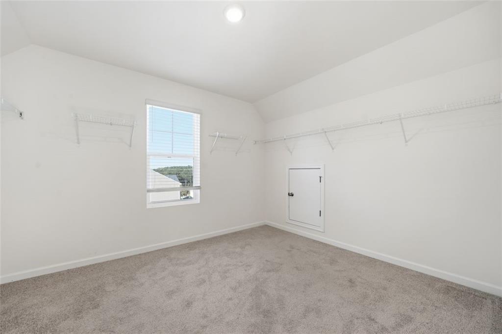 469 Ralph Still Road Dacula, GA 30019 - Photo 32 of 42 an empty room with windows