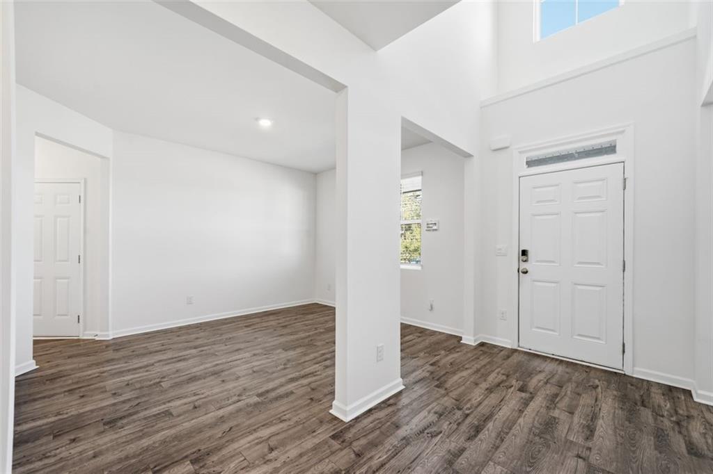 469 Ralph Still Road Dacula, GA 30019 - Photo 5 of 42 a view of an empty room with wooden floor