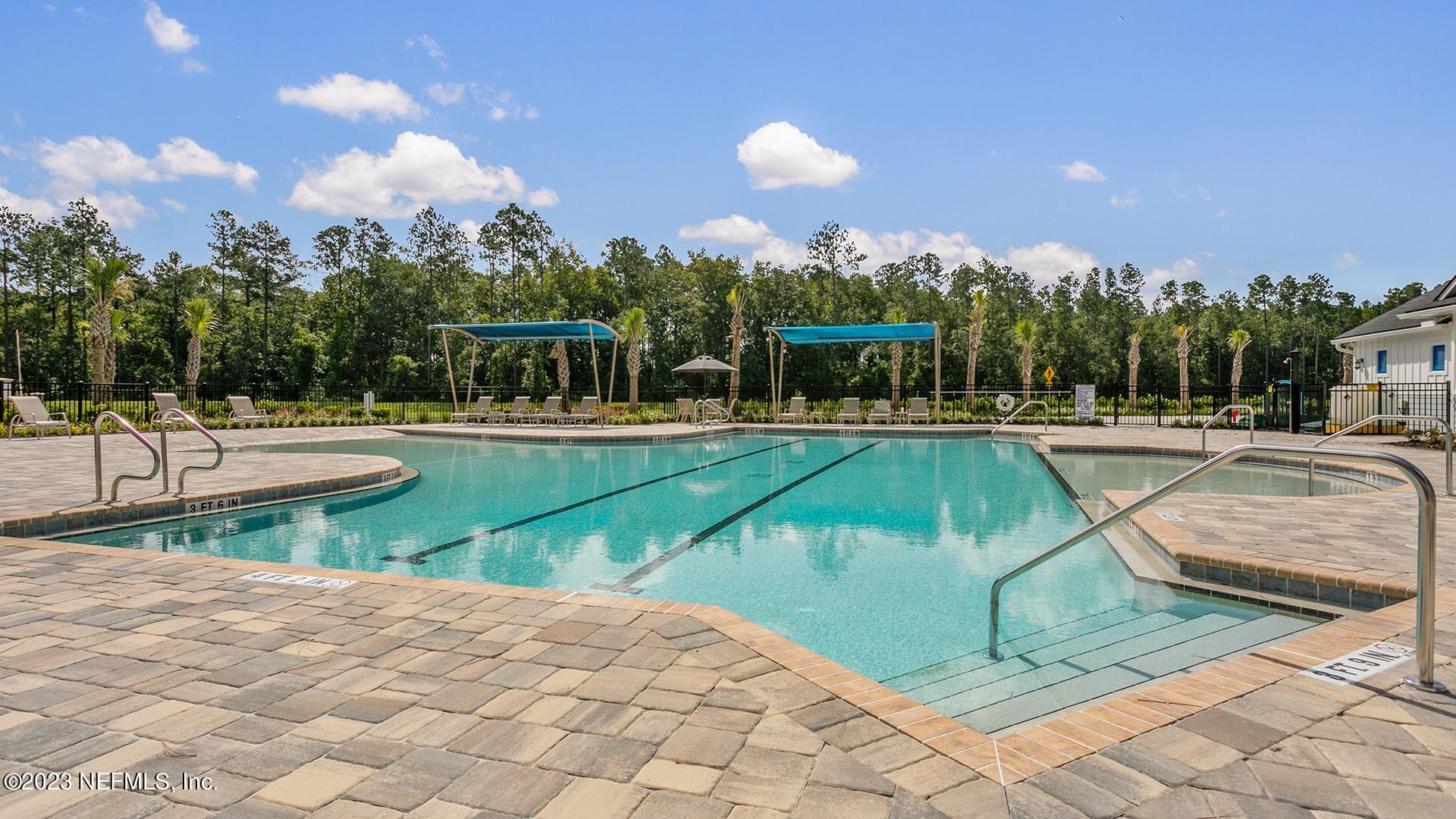 120 Java Lane St. Augustine, FL 32092 - Photo 24 of 37 a view of a swimming pool with a lounge chairs