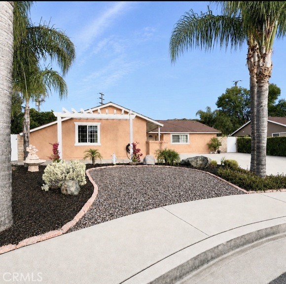 21104 Rosedell Drive Saugus, CA 91350 - Photo 30 of 33 Front exterior garden accented with desert rocks located towards the end of the cul d' sac