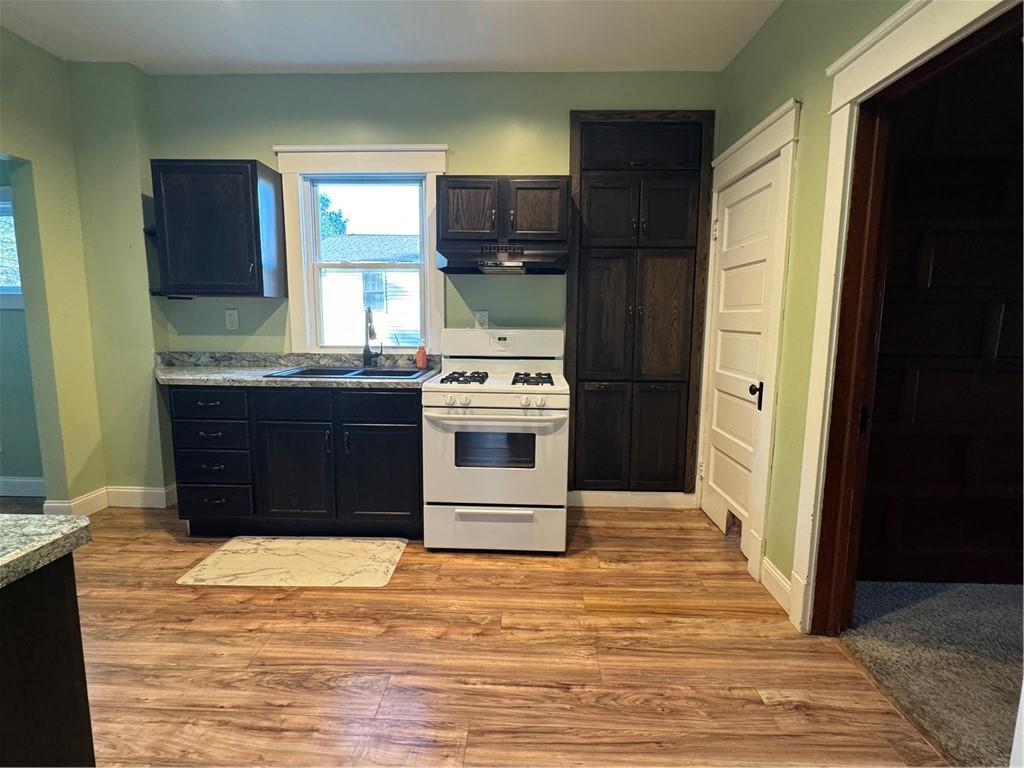 351 North Pitt Street Mercer, PA 16137 - Photo 11 of 39 a kitchen with stainless steel appliances granite countertop a stove a refrigerator and a sink