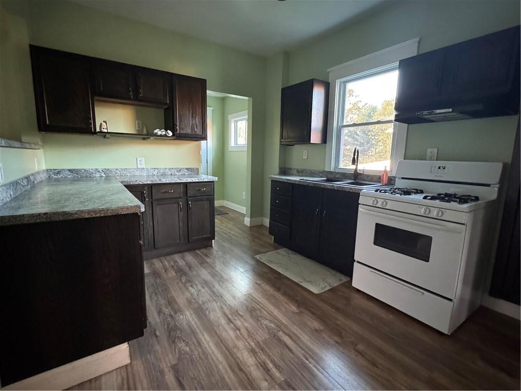 351 North Pitt Street Mercer, PA 16137 - Photo 10 of 39 a kitchen with stainless steel appliances granite countertop wooden cabinets stove top oven and sink