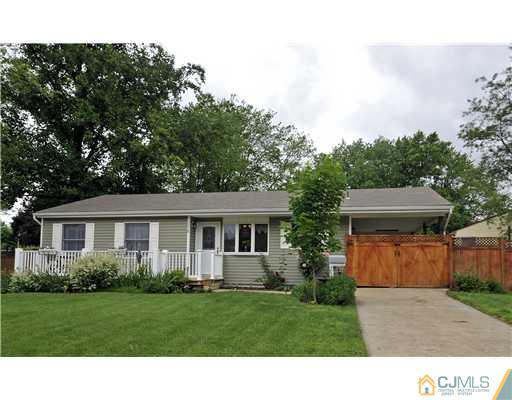 3028 Cheesequake Road Old Bridge, NJ 08859 - Photo 1 of 16 a front view of a house with a yard