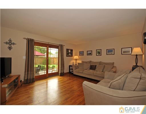 3028 Cheesequake Road Old Bridge, NJ 08859 - Photo 2 of 16 a living room with furniture window and a flat screen tv
