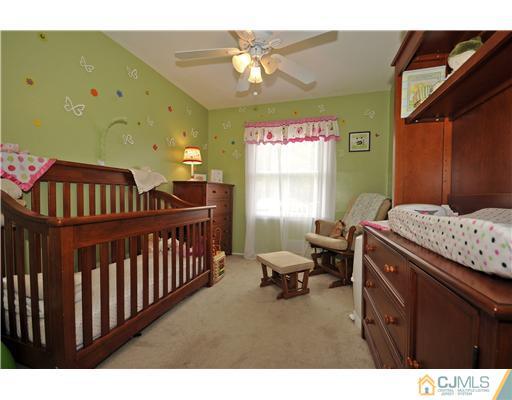 3028 Cheesequake Road Old Bridge, NJ 08859 - Photo 11 of 16 a bedroom with furniture and a window
