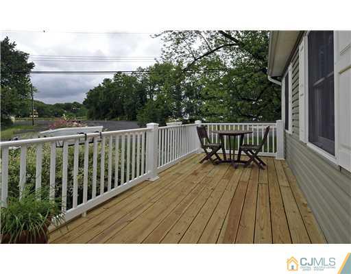 3028 Cheesequake Road Old Bridge, NJ 08859 - Photo 13 of 16 a view of balcony with wooden floor and outdoor seating
