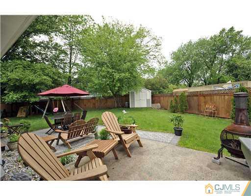 3028 Cheesequake Road Old Bridge, NJ 08859 - Photo 15 of 16 a swimming pool with outdoor seating outdoor seating and green space
