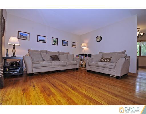3028 Cheesequake Road Old Bridge, NJ 08859 - Photo 3 of 16 a living room with furniture and a wooden floor