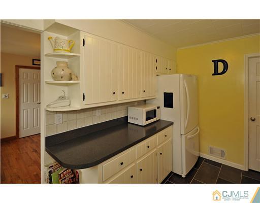 3028 Cheesequake Road Old Bridge, NJ 08859 - Photo 6 of 16 a bathroom with a sink a mirror and a shower