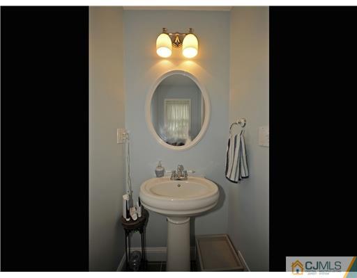 3028 Cheesequake Road Old Bridge, NJ 08859 - Photo 9 of 16 a bathroom with a sink and a mirror