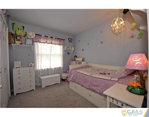3028 Cheesequake Road Old Bridge, NJ 08859 - Photo 10 of 16 a bedroom with furniture and a window