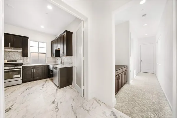 a white toilet sitting next to a bath tub
