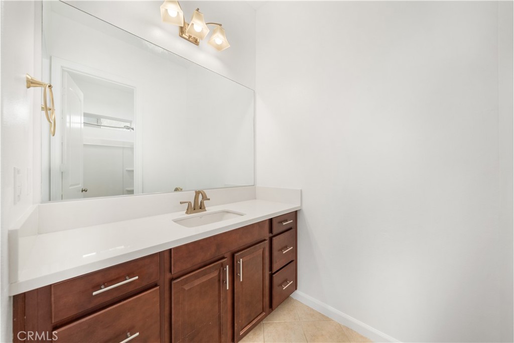 12210 Alamo Drive Rancho Cucamonga, CA 91739 - Photo 19 of 53 a bathroom with a sink and a mirror
