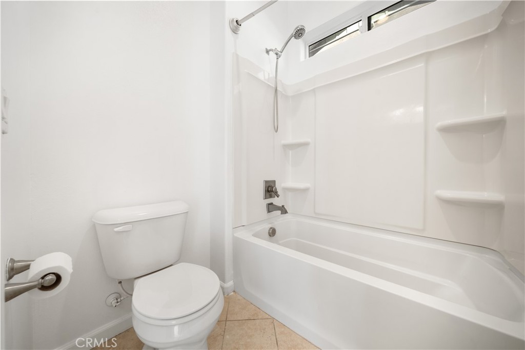 12210 Alamo Drive Rancho Cucamonga, CA 91739 - Photo 20 of 53 a white toilet sitting next to a bath tub