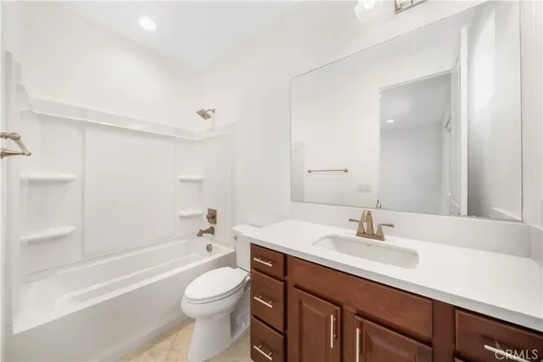 a view of a storage and utility room with washer and dryer