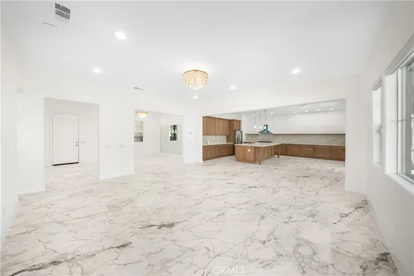 a large white room with kitchen