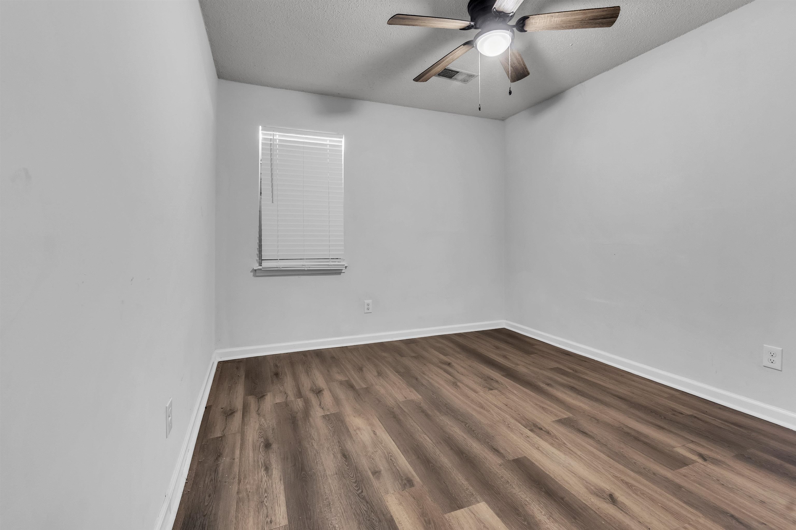 1532 Silver Street Memphis, TN 38106 - Photo 4 of 14 wooden floor in an empty room