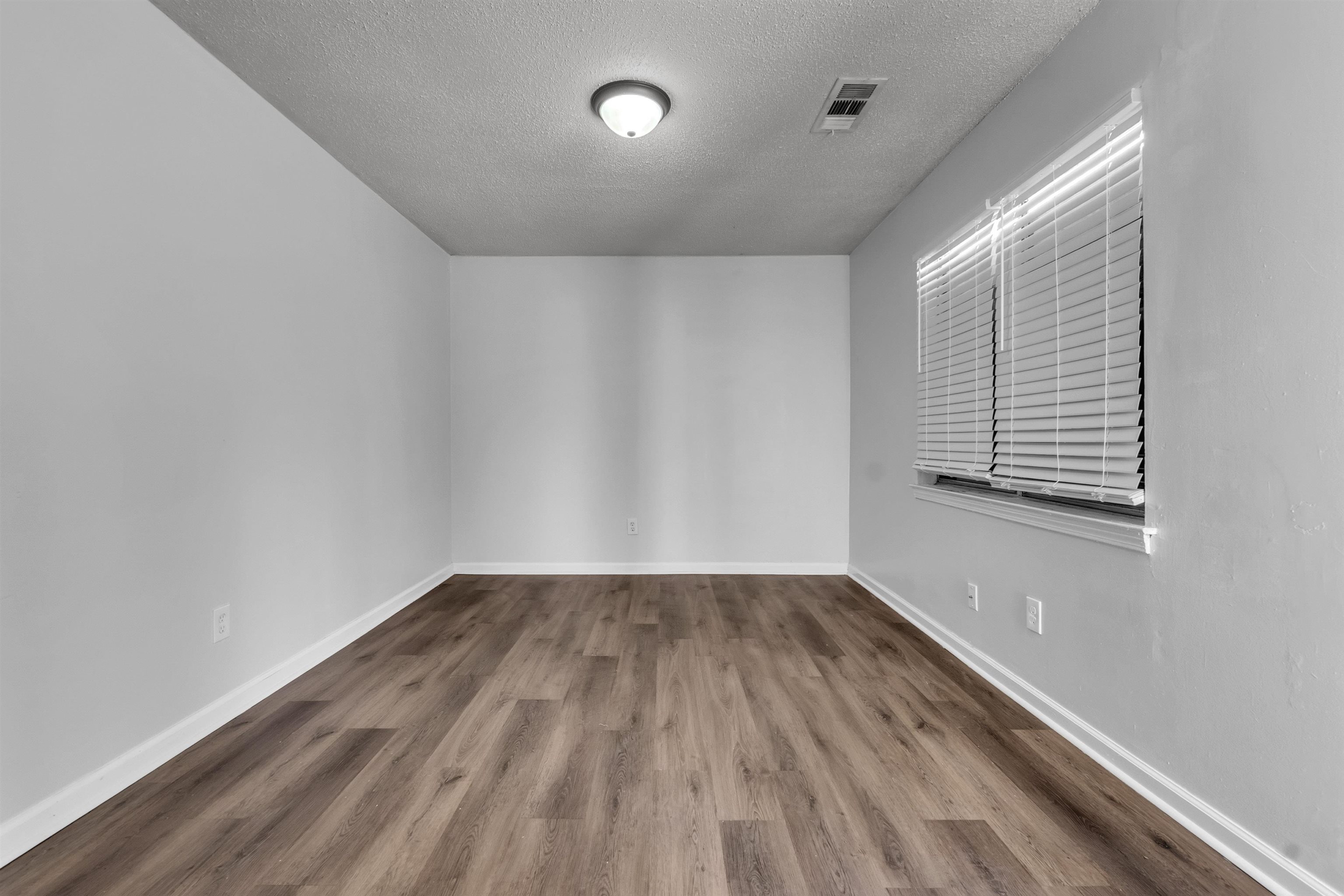1532 Silver Street Memphis, TN 38106 - Photo 9 of 14 a view of a room with wooden floor and window