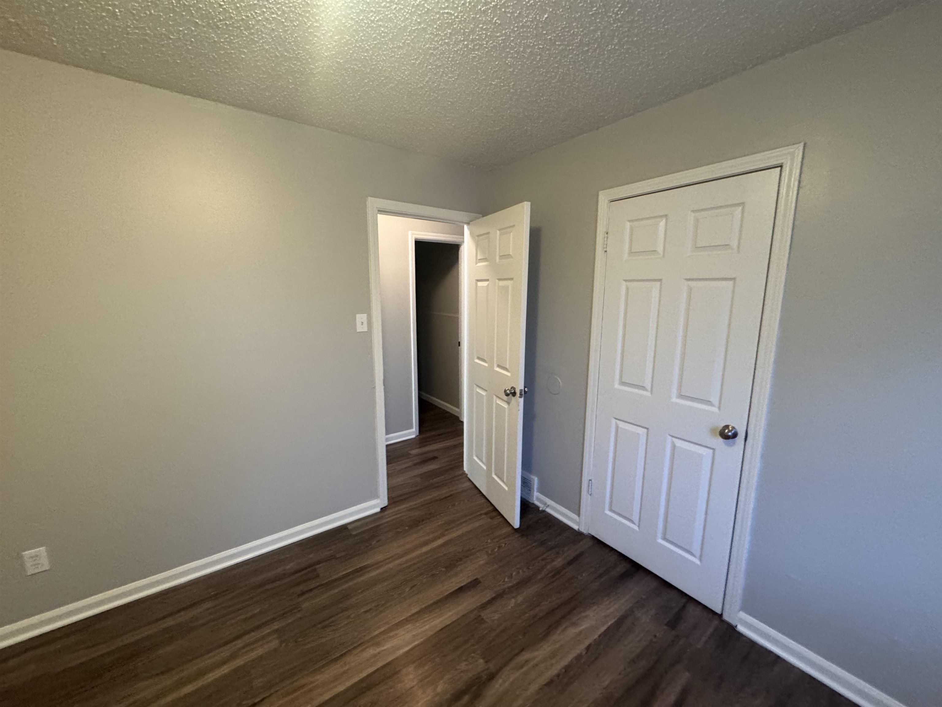 745 Harahan Road Memphis, TN 38109 - Photo 12 of 15 a view of a hallway with wooden floor