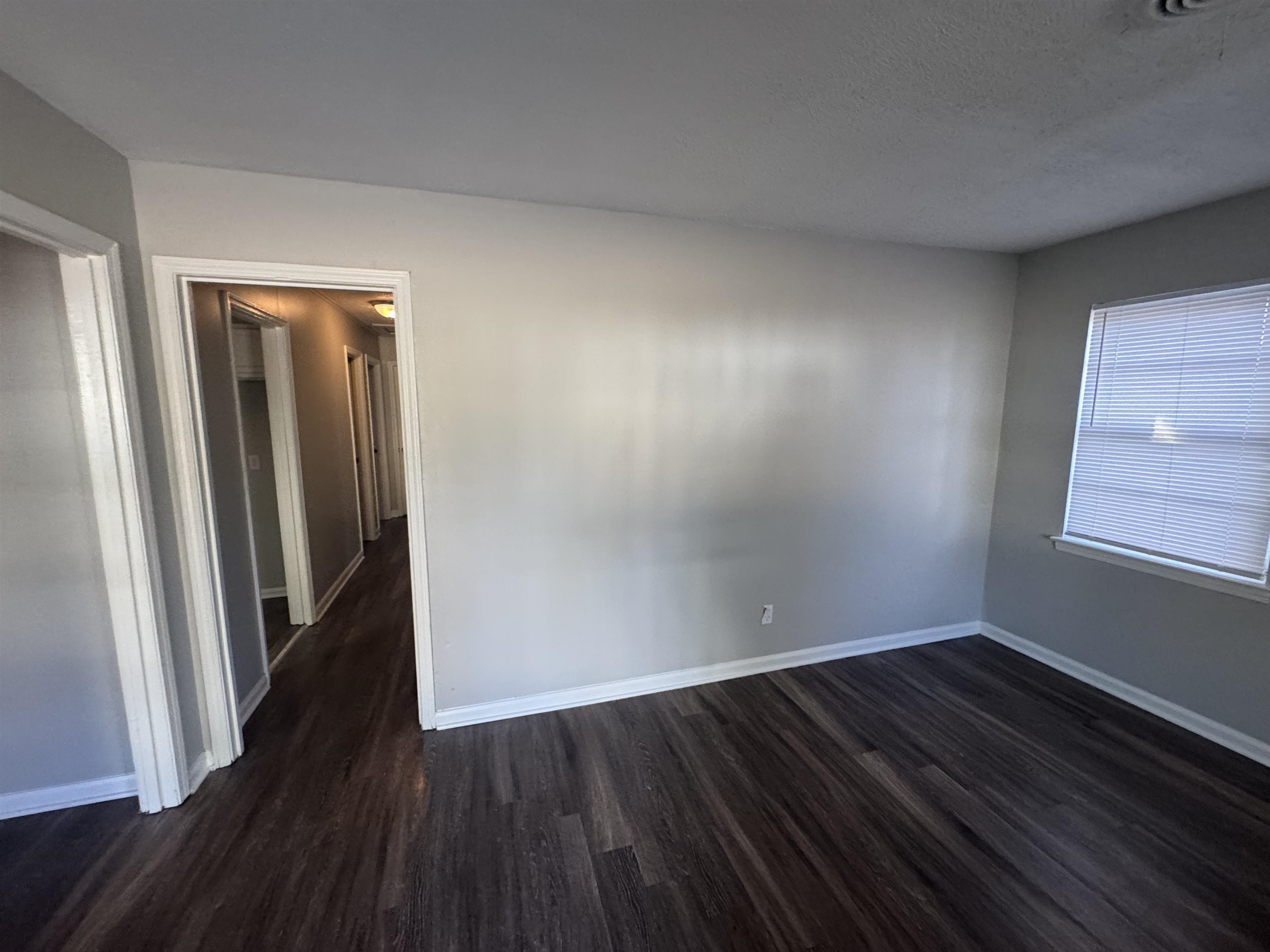 745 Harahan Road Memphis, TN 38109 - Photo 3 of 15 an empty room with wooden floor and closet