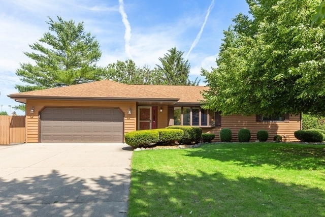 728 Schoolgate Road New Lenox, IL 60451 - Photo 2 of 24 a front view of a house with garden